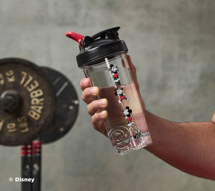 pro-series-y9 Mickey_Mouse_Protein_Shaker_Bottle_Being_Held_In_the_Gym.jpg